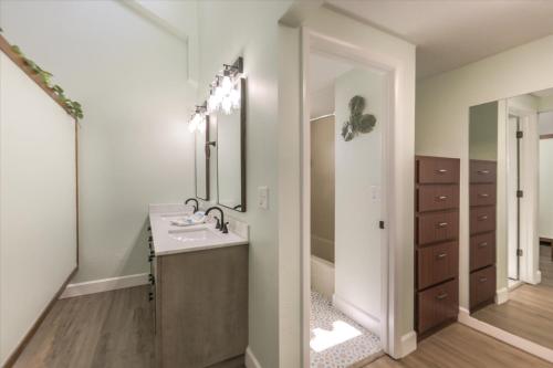 a bathroom with a sink and a mirror at Sunshine Lagoon in Sanibel