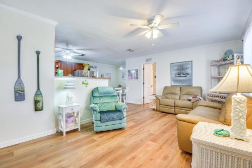 a living room with a couch and a chair at 1 Mi to Anna Maria Island Pet-Friendly Retreat in Cortez