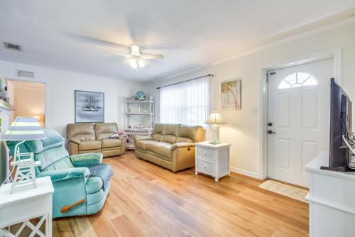 a living room with two couches and a tv at 1 Mi to Anna Maria Island Pet-Friendly Retreat in Cortez