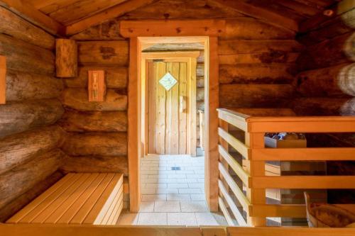 a room with a door in a log cabin at Sure Hotel by Best Western Rhoen Garden in Poppenhausen