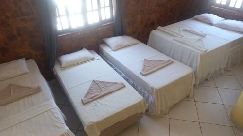 Katil atau katil-katil dalam bilik di Pousada Terral - Broadway em Canoa Quebrada