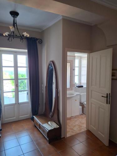 a bathroom with a mirror and a sink at Villa Hydra Estrella in Hydra