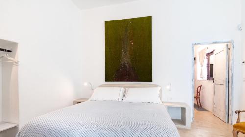 Una cama o camas en una habitación de Petranima Wellness in Trulli