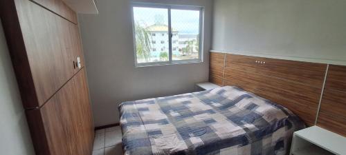 Ένα ή περισσότερα κρεβάτια σε δωμάτιο στο Apartamento Completo 2 Quartos