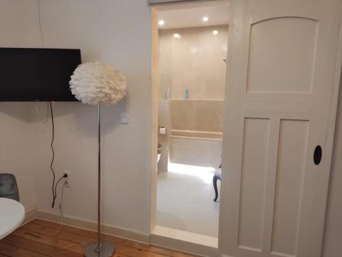 a white door in a room with a bathroom at BellaCaro in Löhne