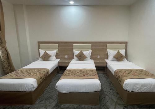 Katil atau katil-katil dalam bilik di ريست ان Rest In Hotel
