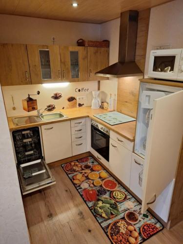 a kitchen with a rug on the floor at B&U Fewo Scherhag in Alken