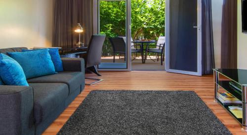 Area soggiorno di The Peninsula Riverside Serviced Apartments