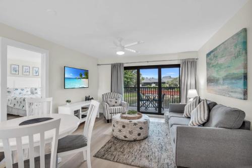 a living room with a couch and a table at Updated and Beautiful Views in Naples