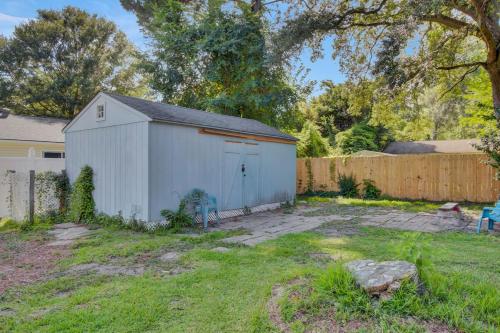 a white shed in a yard next to a fence at Charleston, near Airport, luxury and cozy house in Ladson