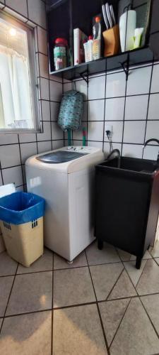 a small bathroom with a sink and a toilet at Quarto compartilhado Costa Norte in Florianópolis