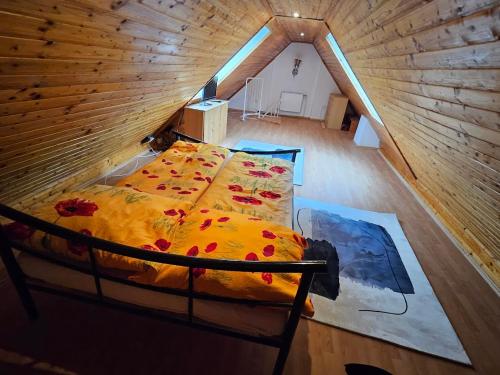 an overhead view of a bed in a wooden cabin at Pension DonauBlick Grein 2 in Stifterstrasse 19A in Grein
