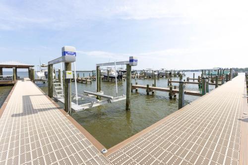 a dock with a docking station on the water at Bay View 6 in Orange Beach
