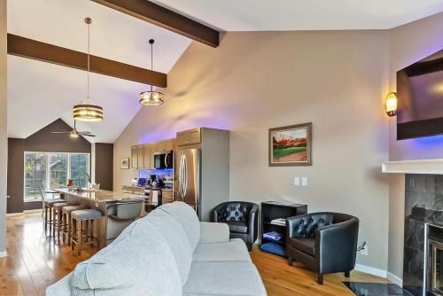 a living room with a couch and a kitchen at Pet Friendly Townhouse in Edwards Community in Edwards