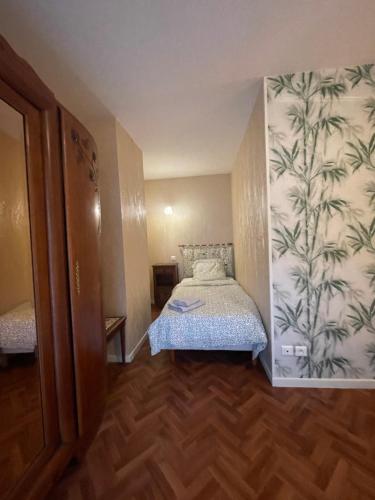 Postel nebo postele na pokoji v ubytování Sensation, chambre 2 lits pour 3 personnes, avec salle de bain privative