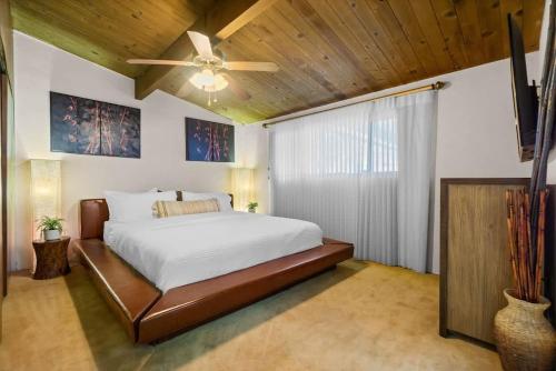 a bedroom with a bed and a ceiling fan at Mountain Majesty with AC BBQ Parking in Lemon Grove