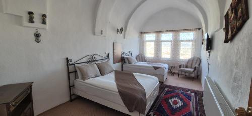 Postel nebo postele na pokoji v ubytování Cappadocia Landscape House