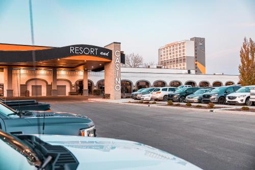 a row of cars parked in front of a parking lot at Red Deer Resort & Casino in Red Deer