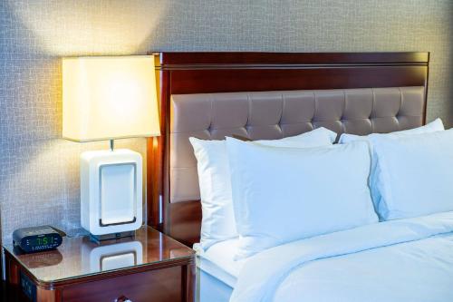 a bedroom with a bed and a tv on a night stand at Red Deer Resort & Casino in Red Deer