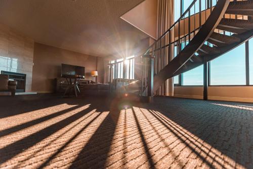 a room with sunlight shining through the windows of a building at Red Deer Resort & Casino in Red Deer