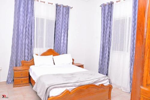Postel nebo postele na pokoji v ubytování Kums Apartment