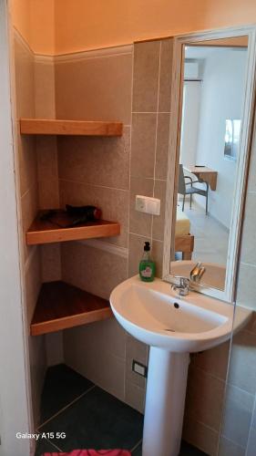 a bathroom with a sink and a mirror at Beach Villa am Praia de Chaves, Boa Vista, Cabo Verde in Boa Ventura