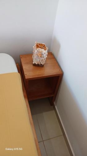 a small table next to a bed in a room at Beach Villa am Praia de Chaves, Boa Vista, Cabo Verde in Boa Ventura