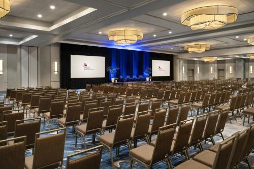 a large room with rows of chairs and a stage at Torrance Marriott Redondo Beach in Torrance