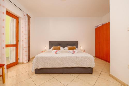 Katil atau katil-katil dalam bilik di Apartmani ANE