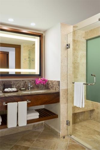 a bathroom with a sink and a mirror at Hyatt Ziva Puerto Vallarta - All Inclusive in Puerto Vallarta
