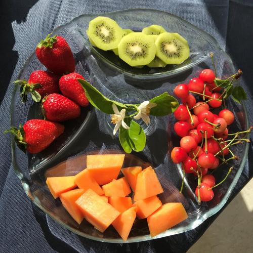 a tray of fruit and vegetables on a table at Relais Masseria della Colomba - Agriturismo in Francavilla Fontana