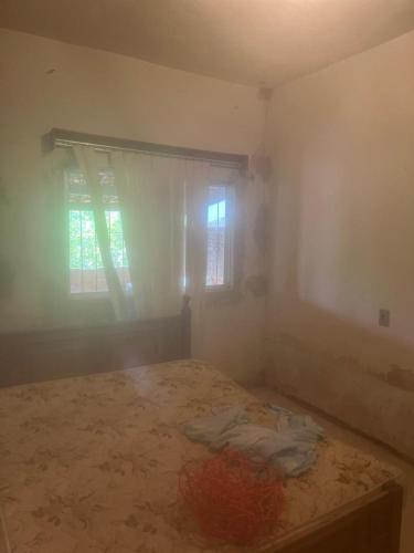 Ένα ή περισσότερα κρεβάτια σε δωμάτιο στο Casa Confortável em Matheus Leme