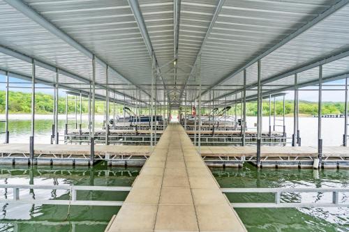 a large building with a dock in the water at Luxury Lakefront Chalet Resort 2 Pools FREE Amenities Dock MiniGolf Waterslide in Lampe