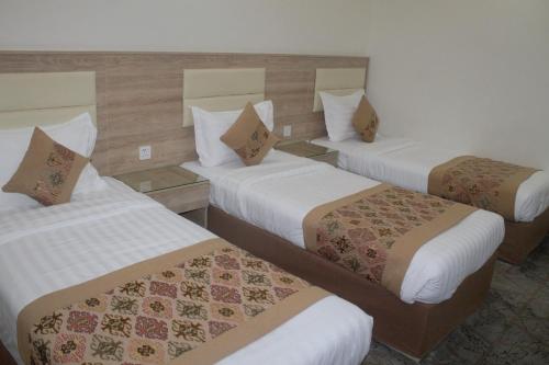 Katil atau katil-katil dalam bilik di ريست ان Rest In Hotel