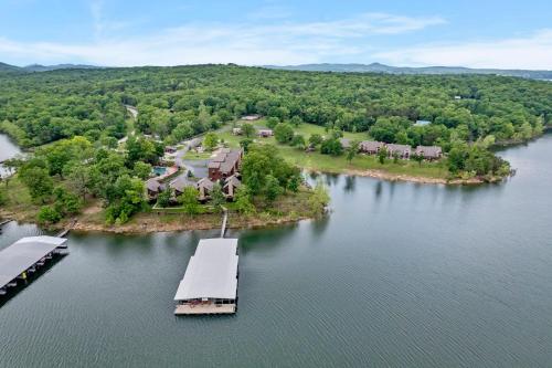 an aerial view of a house on an island in the water at Chalets Resort LAKEFRONT Cottage Free Amenities Amazing views Kayaks 2 Pools in Lampe