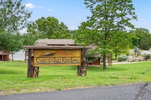 a sign that says chests have roostle in a park at Chalets Resort LAKEFRONT Cottage Free Amenities Amazing views Kayaks 2 Pools in Lampe