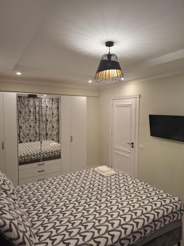 Ένα ή περισσότερα κρεβάτια σε δωμάτιο στο ClausStudio Greenfield Baneasa