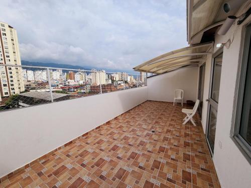 a balcony with a view of a city at 901 Apt balcón terraza Muy Amplio in Bucaramanga