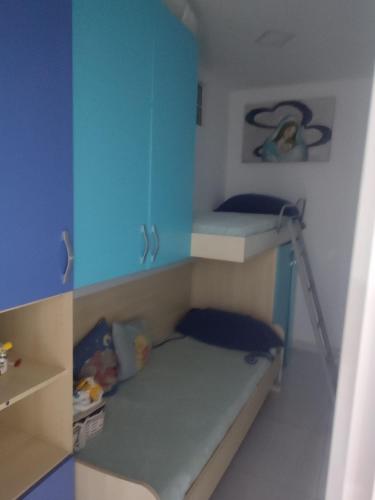 a small room with a bunk bed and a bunk bed at Annyhouse via litoranea 38 in Torre del Greco