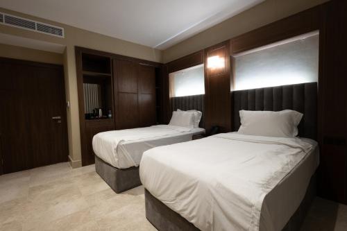 Postel nebo postele na pokoji v ubytování Doyof Hotel فندق ضيوف