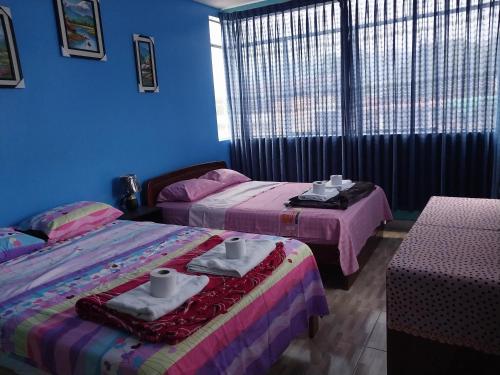 Letto o letti in una camera di Departamento de 4 camas dobles