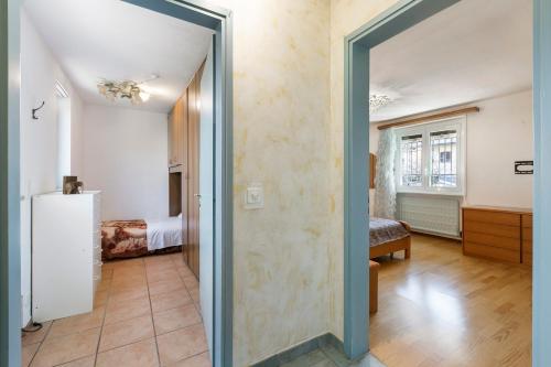 a hallway with a door leading to a bedroom at Villa Anita - Happy Rentals in Caslano