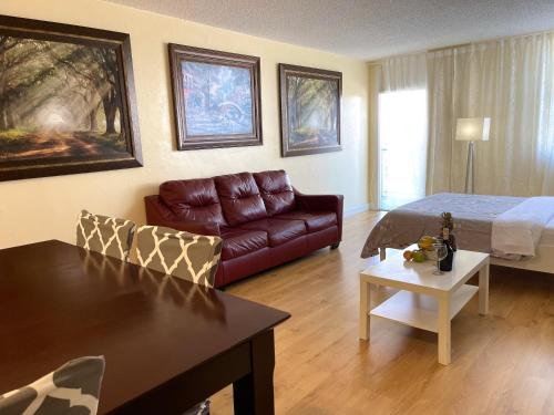 a living room with a couch and a bed at Family Stay Ocean Reserve Resort Sunny Isles in Sunny Isles Beach