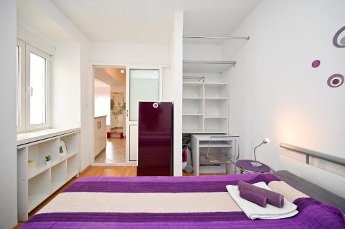 En eller flere senge i et værelse på Apartment Bazen