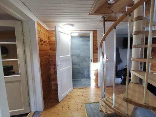 a staircase leading to a bathroom in a tiny house at Villa Naukkari in Syöte