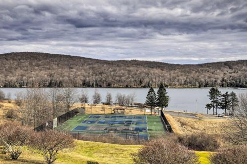 an empty swimming pool on the shore of a lake at Hike, Ski and Raft Terra Alta Cabin with Large Deck in Terra Alta