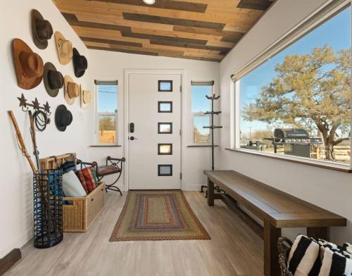 a room with a bench and a window at Number 1 Joshua Tree Escape-Heated Pool in Landers