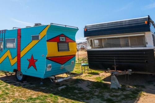 an rv is parked next to a trailer at Number 1 Joshua Tree Escape-Heated Pool in Landers