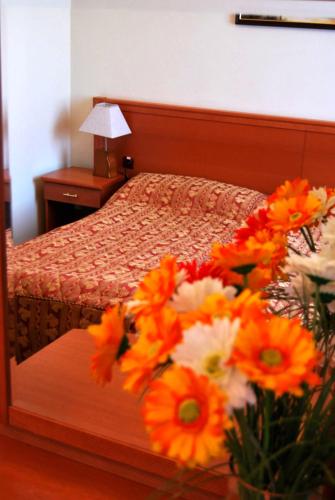 Ένα ή περισσότερα κρεβάτια σε δωμάτιο στο Park Hotel