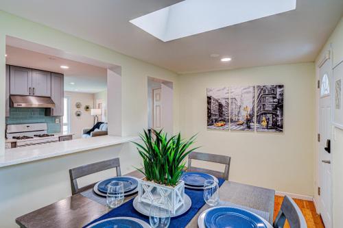 a dining room with a table with blue plates on it at Cozy Home Sleeps 10 Lombard Chicago Suburb in Lombard